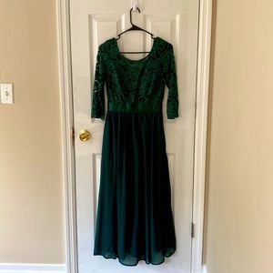 It’s a beautiful dark green dress with half sleeves.